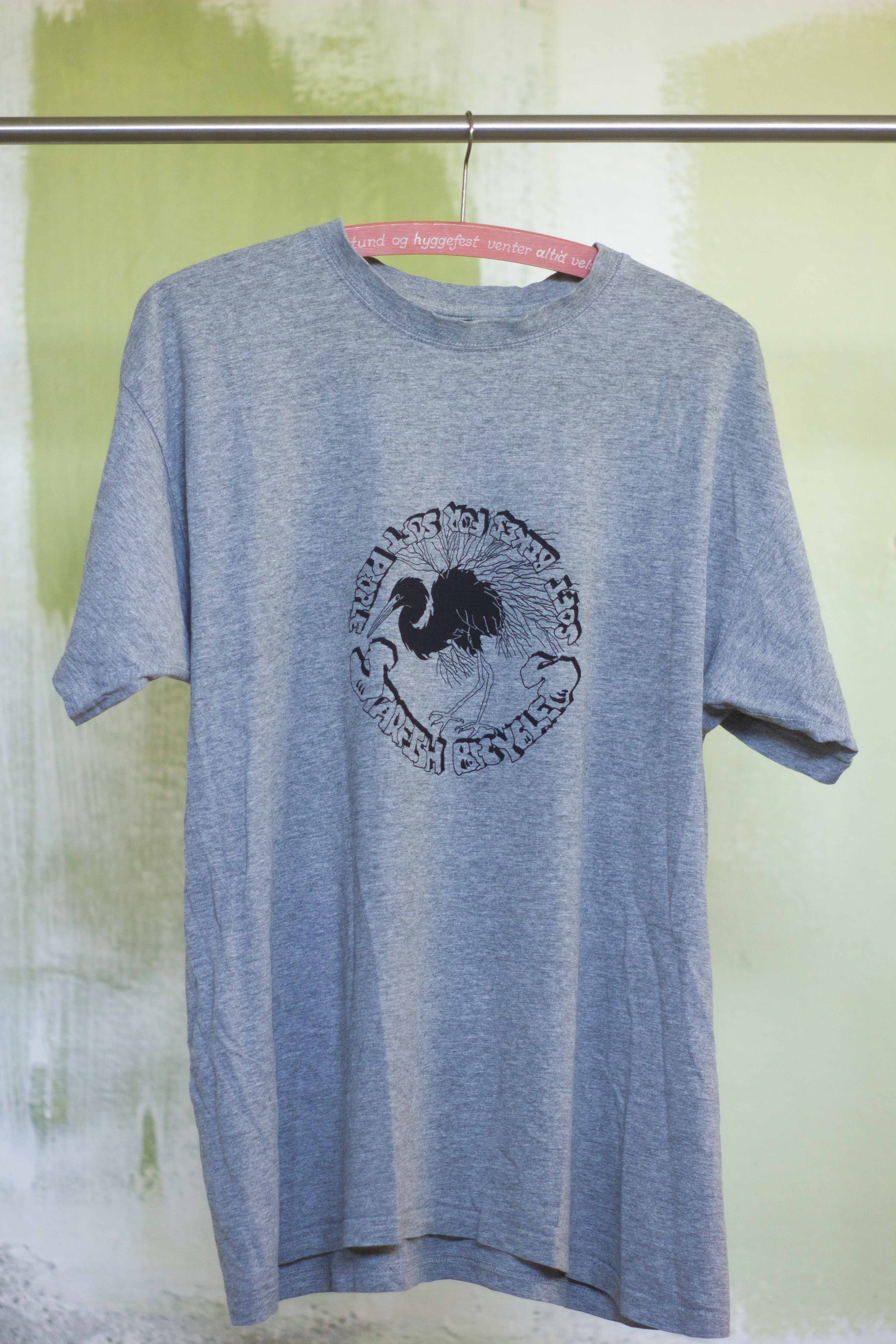 grey t shirt with black print of hand drawn silver heron and the text "Starfish Bicycles soft biikes for soft people" in a punkn diy style