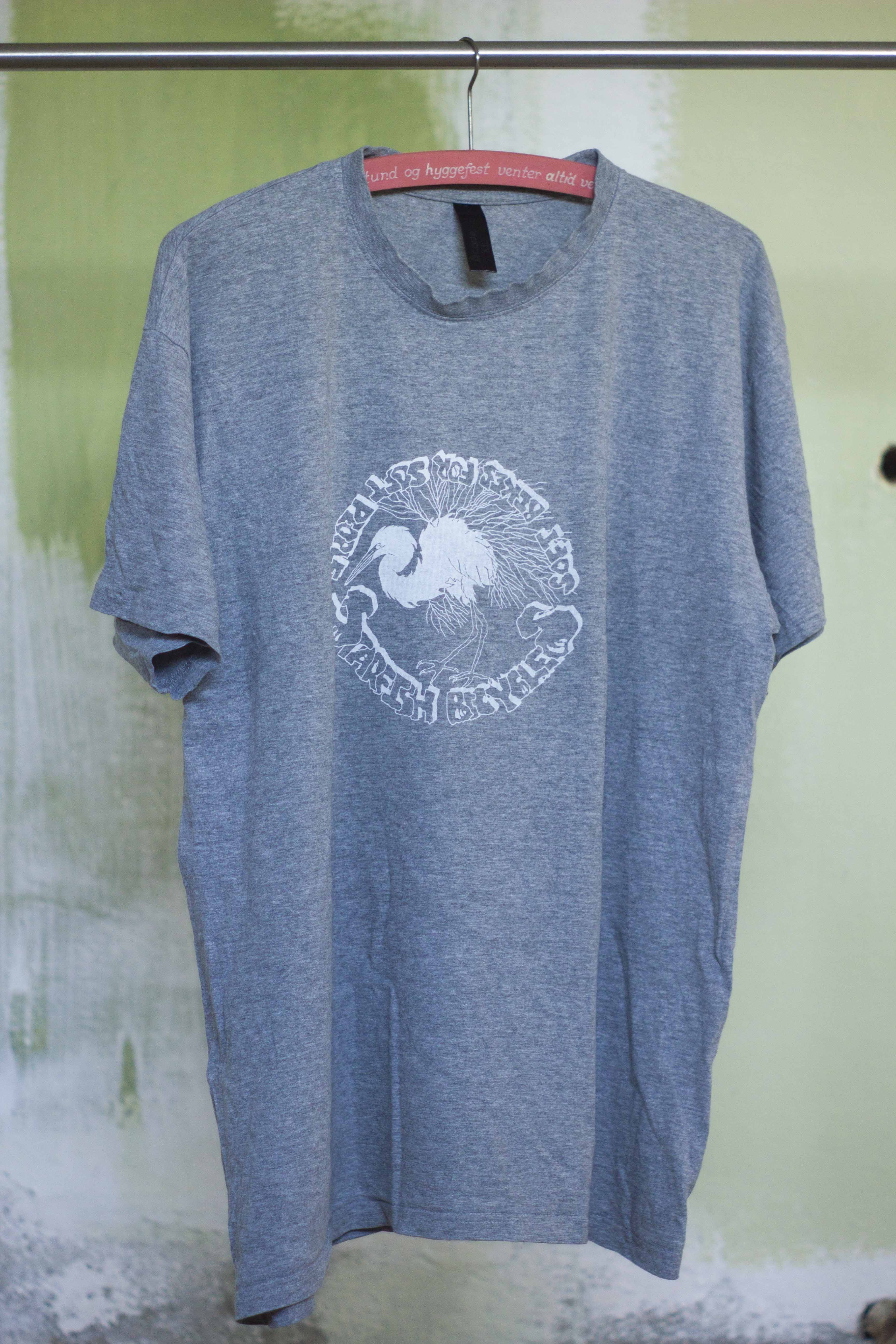 grey t shirt with white print of hand drawn silver heron and the text 